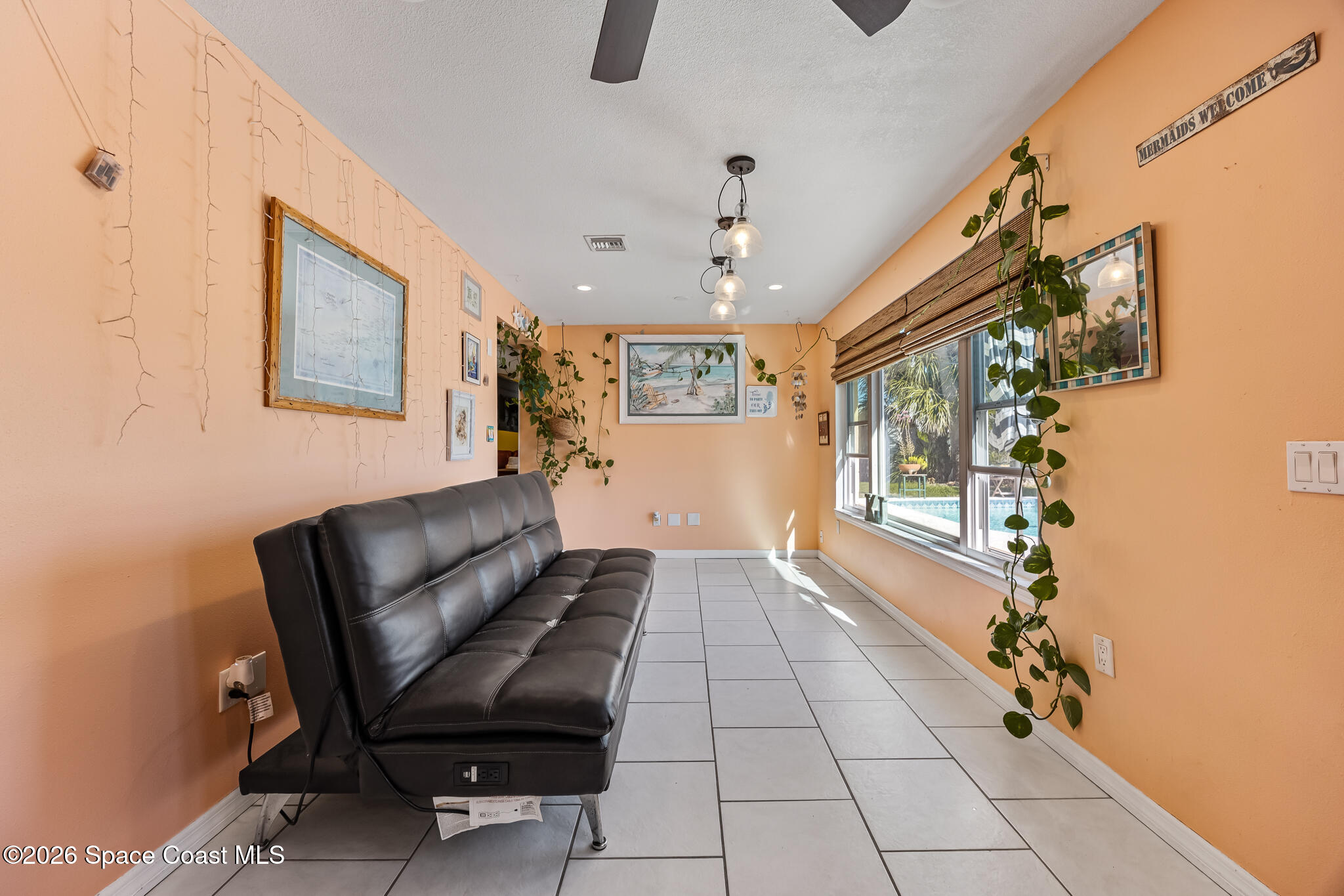 770 New Hampton Way Merritt Island, FL 32953 - Photo 24 of 48 a living room with furniture and a large window