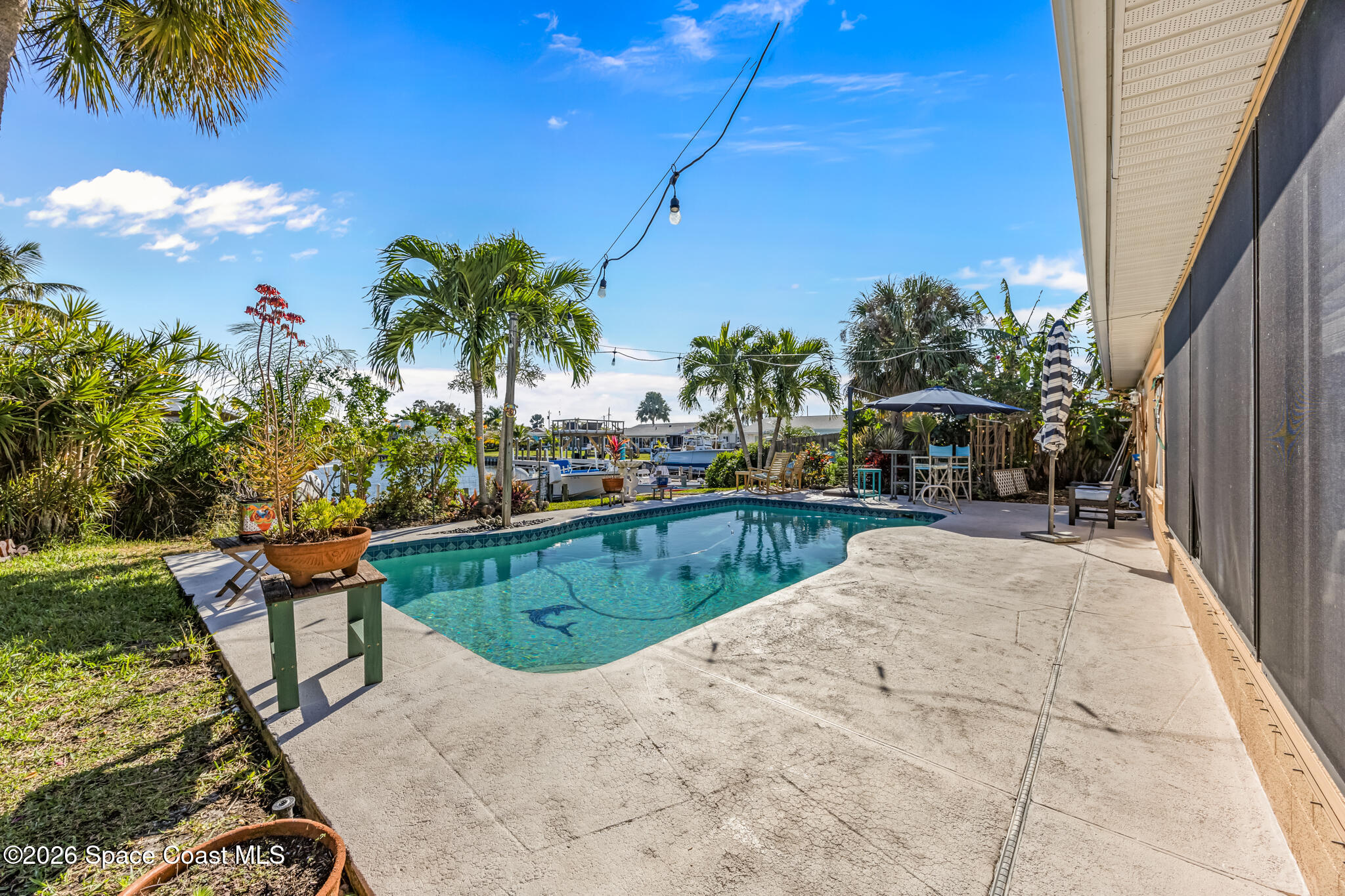 770 New Hampton Way Merritt Island, FL 32953 - Photo 26 of 48 a view of swimming pool with outdoor seating and plants