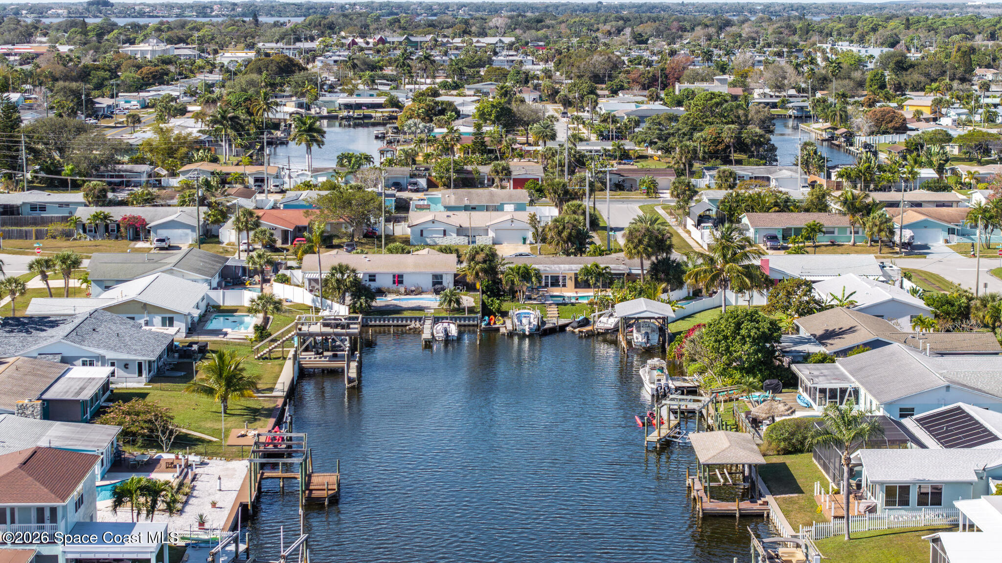 770 New Hampton Way Merritt Island, FL 32953 - Photo 3 of 48 an aerial view of a city with lots of residential buildings