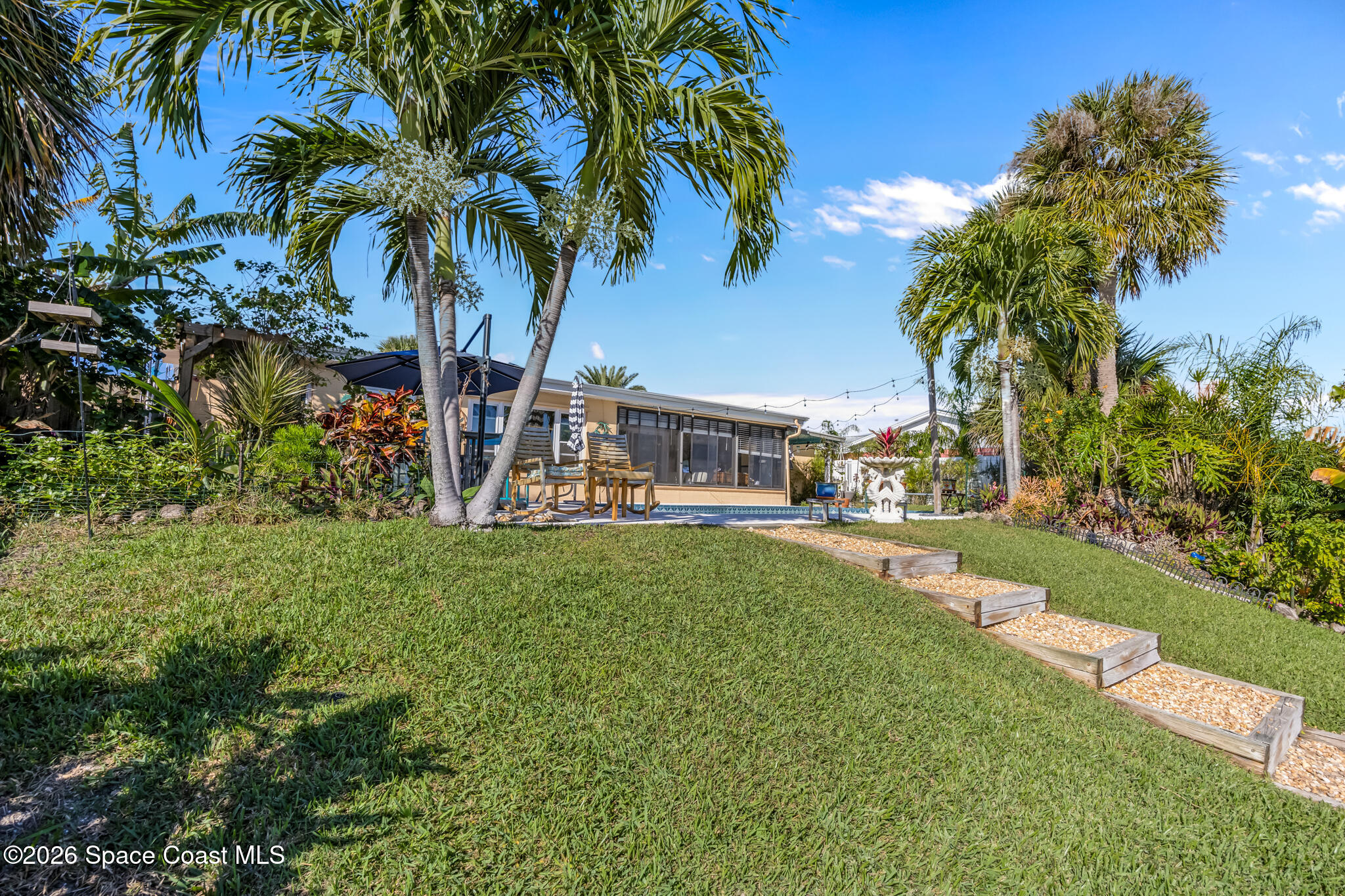 770 New Hampton Way Merritt Island, FL 32953 - Photo 32 of 48 a view of a yard with a palm tree