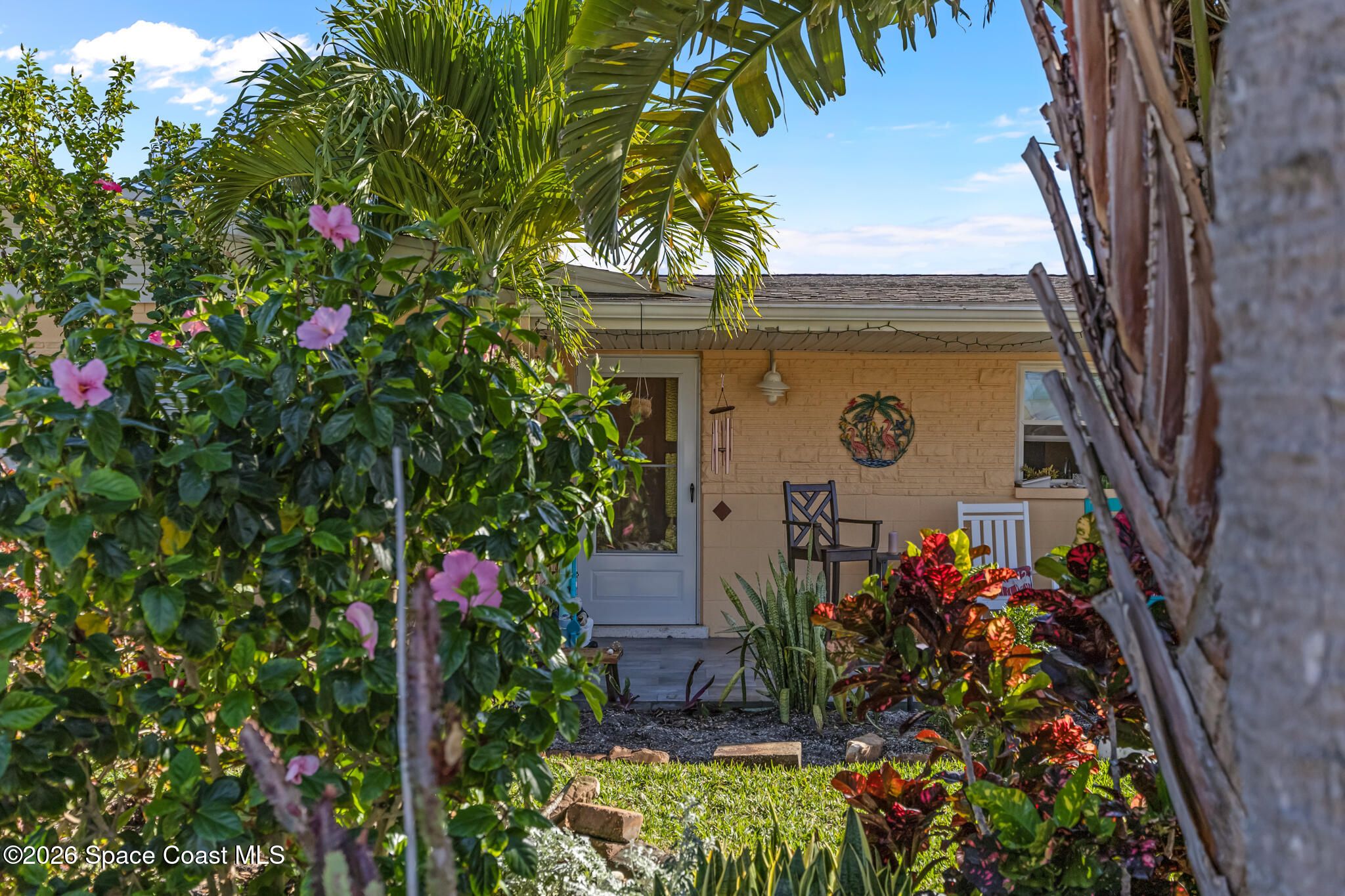 770 New Hampton Way Merritt Island, FL 32953 - Photo 37 of 48 a vase of flowers sitting in front of a house