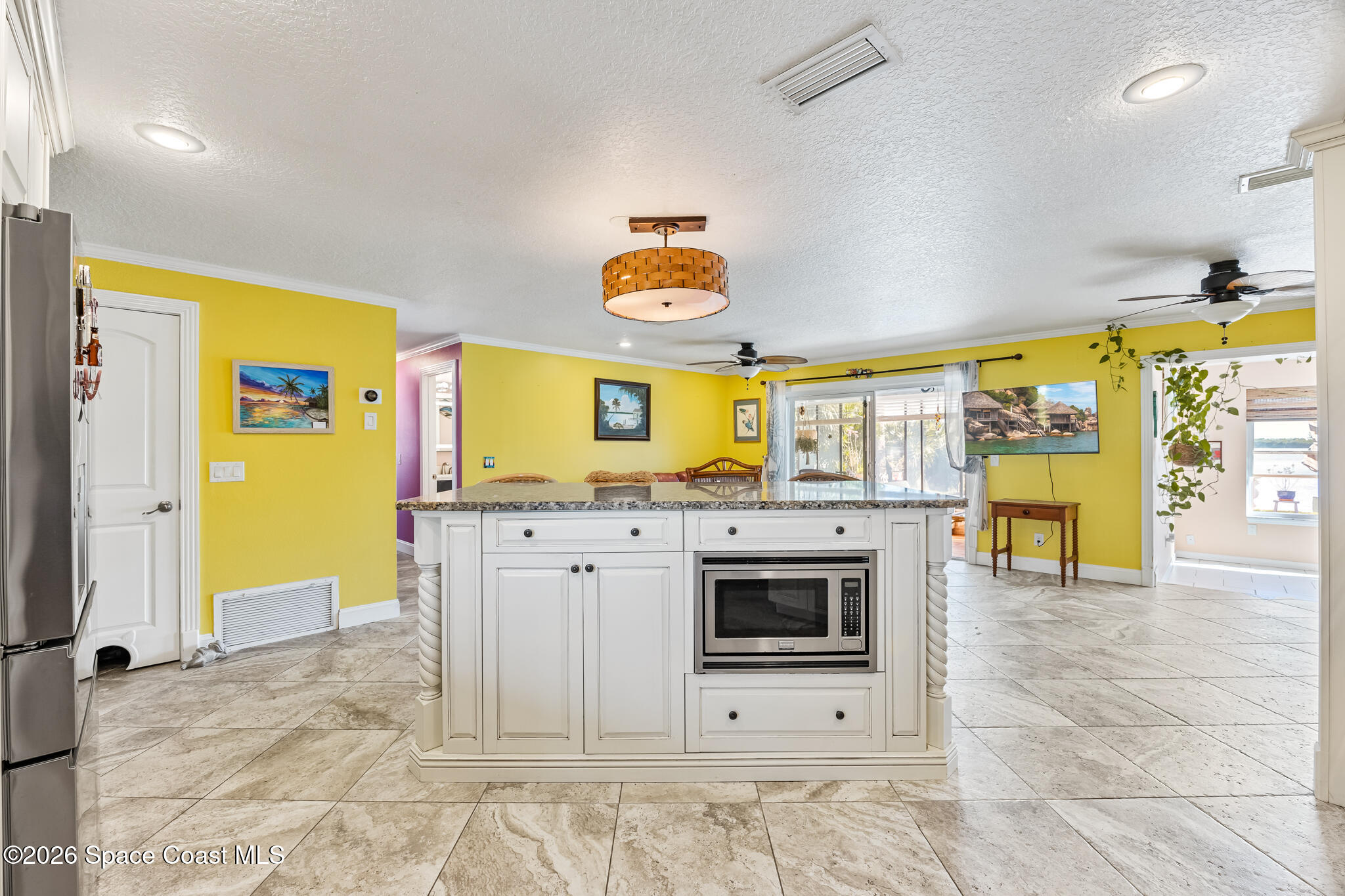 770 New Hampton Way Merritt Island, FL 32953 - Photo 6 of 48 a kitchen with stainless steel appliances granite countertop a stove a sink and a microwave