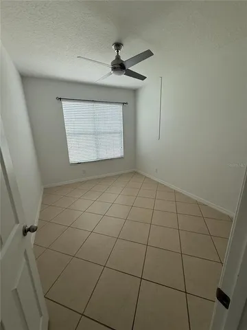 a view of an empty room and a window