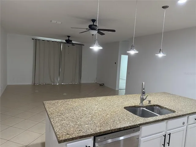 a kitchen with a sink a counter space and a sink