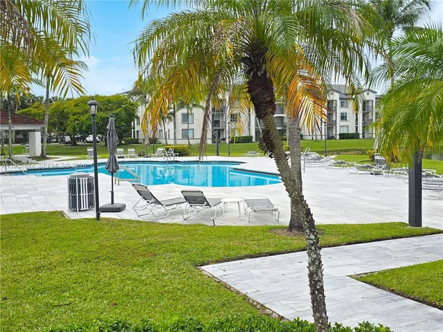 a view of a yard with palm tree