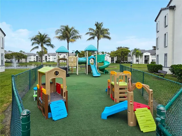 a childrens park with lots of swings and slides