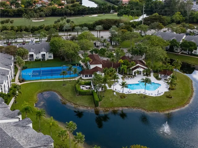 an aerial view of a house with swimming pool outdoor seating and yard