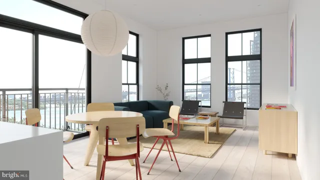 a living room with furniture and floor to ceiling windows