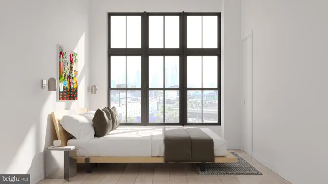 a bedroom with bed and a window