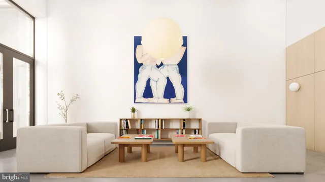 a living room with furniture and wall paintings