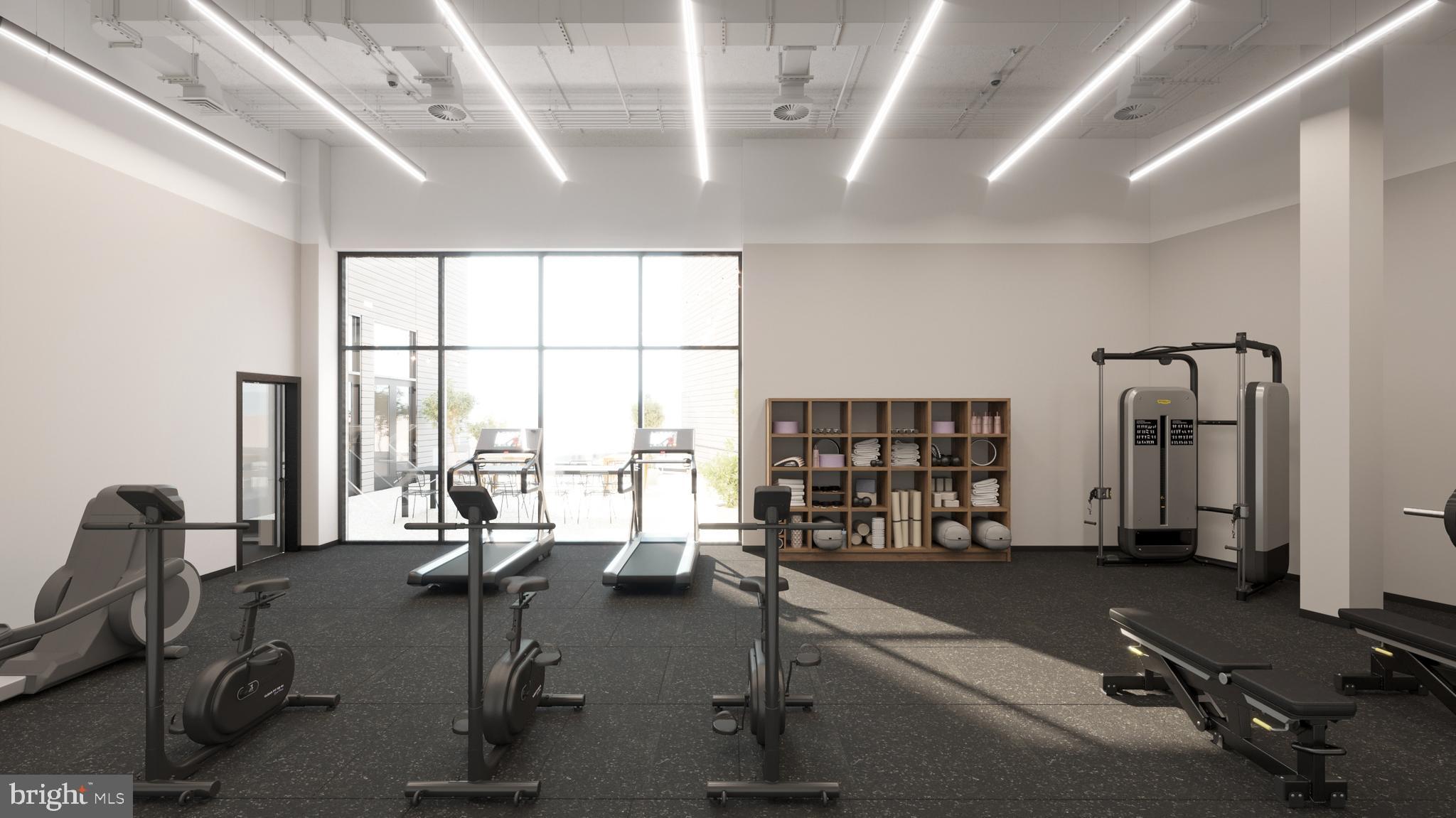 945 Frankford Avenue, Unit 206 Philadelphia, PA 19125 - Photo 7 of 19 a view of a room with gym equipment