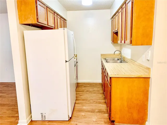 a bathroom with a sink a mirror and a shower
