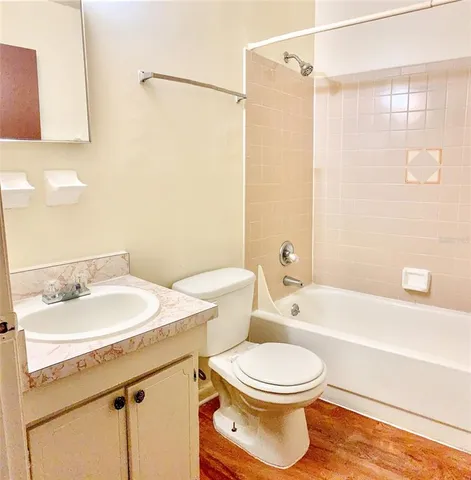 a bathroom with a sink a toilet and a bathtub