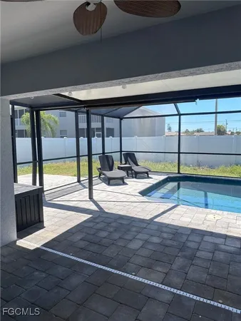 a kitchen with kitchen island granite countertop a sink cabinets and stainless steel appliances