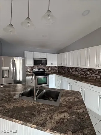 a view of an empty room and a window