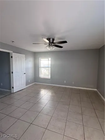 a kitchen with granite countertop a sink a stove and a refrigerator