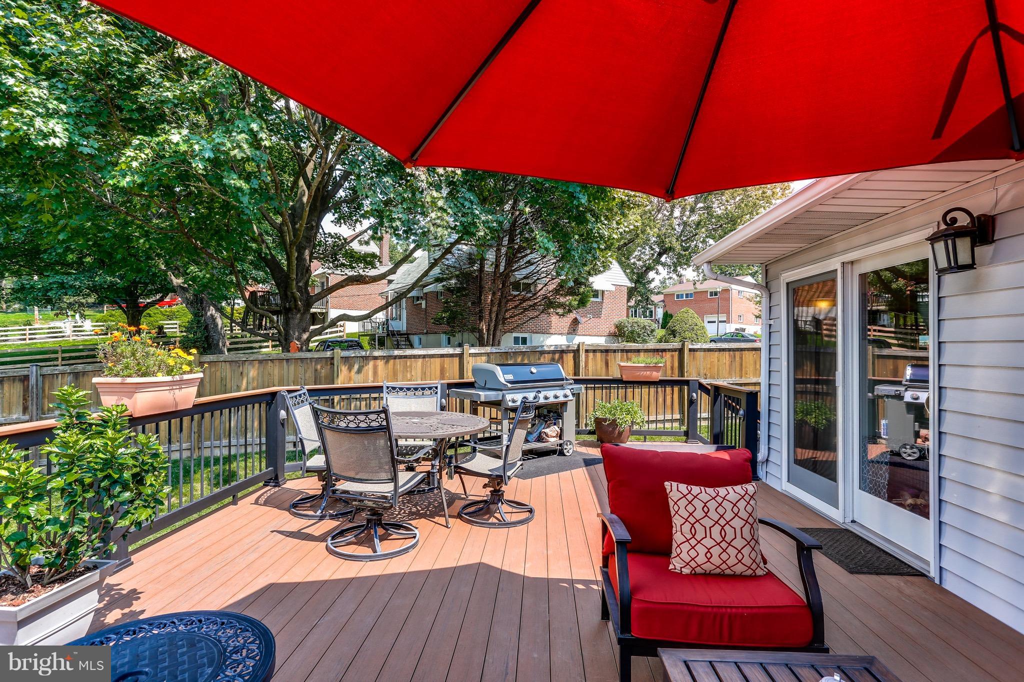 1916 Tadcaster Road Baltimore, MD 21228 - Photo 22 of 28 a view of a balcony with chairs and wooden floor