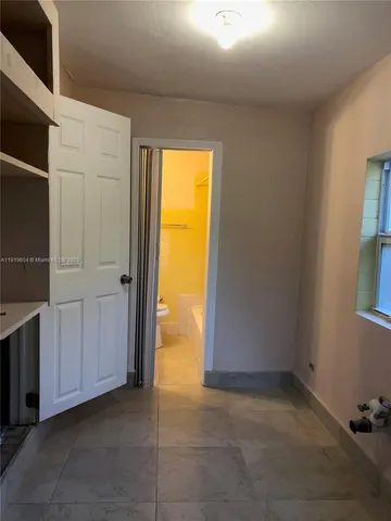 a kitchen with stainless steel appliances granite countertop a stove and a microwave