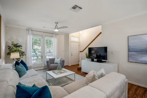 a kitchen with a sink cabinets and a wooden floor
