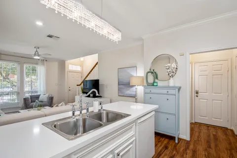 a bathroom with a tub a sink and a shower