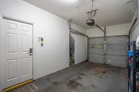 a bathroom with a shower sink and mirror