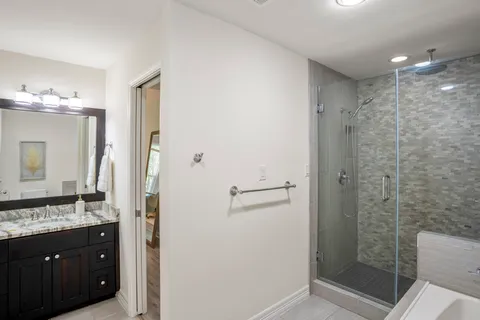 a front view of a house with a yard and a garage