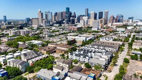 a backyard of a house with outdoor seating