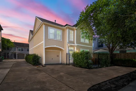 a living room with furniture and stairs