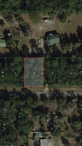 a view of a backyard with sitting area