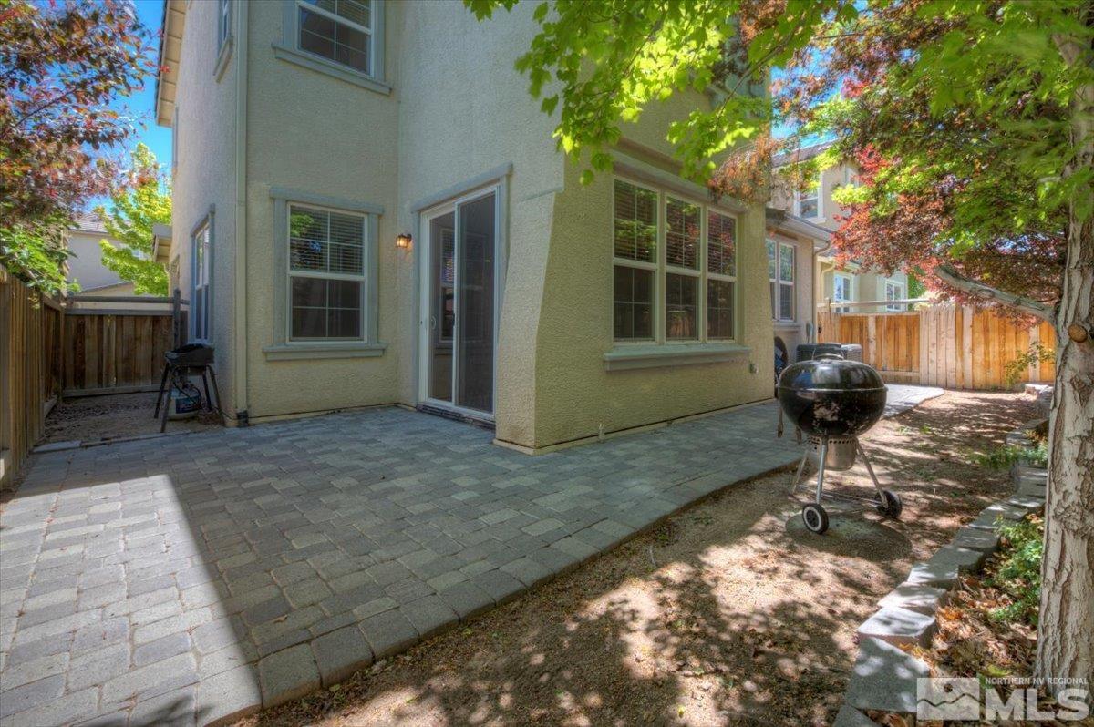 6923 Sacred Circle Sparks, NV 89436 - Photo 11 of 27 a front view of a house with a yard