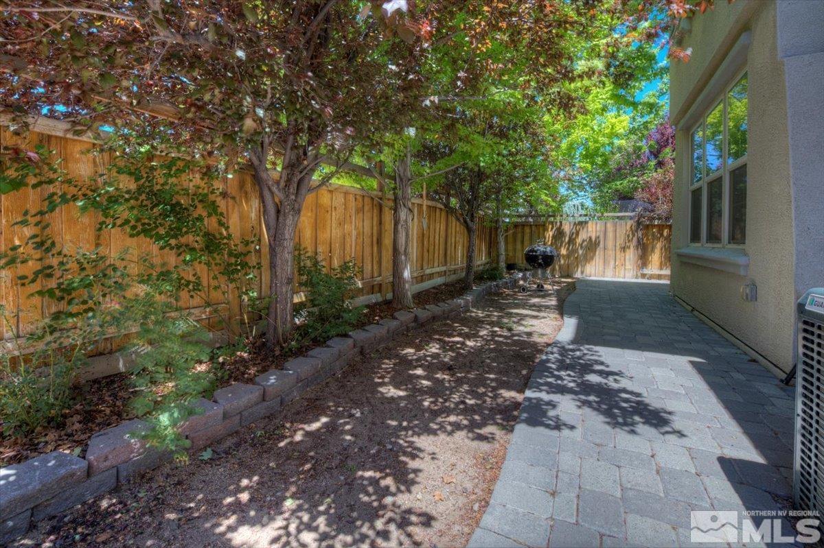 6923 Sacred Circle Sparks, NV 89436 - Photo 13 of 27 a backyard of a house with lots of green space