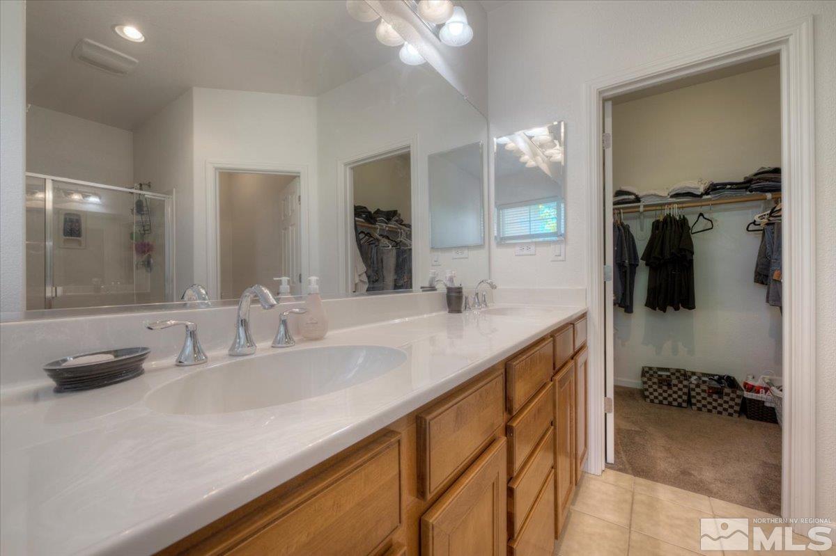 6923 Sacred Circle Sparks, NV 89436 - Photo 19 of 27 a bathroom with a sink double vanity