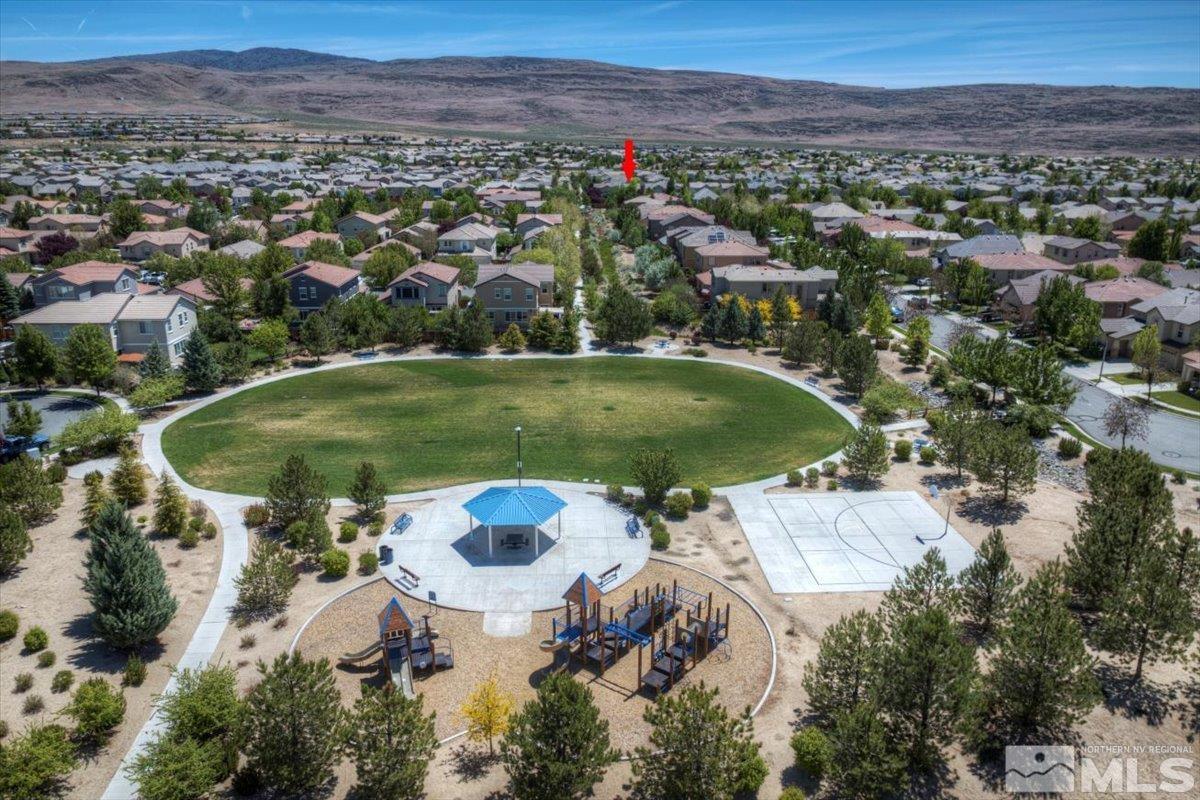 6923 Sacred Circle Sparks, NV 89436 - Photo 26 of 27 an aerial view of a swimming pool and mountain view
