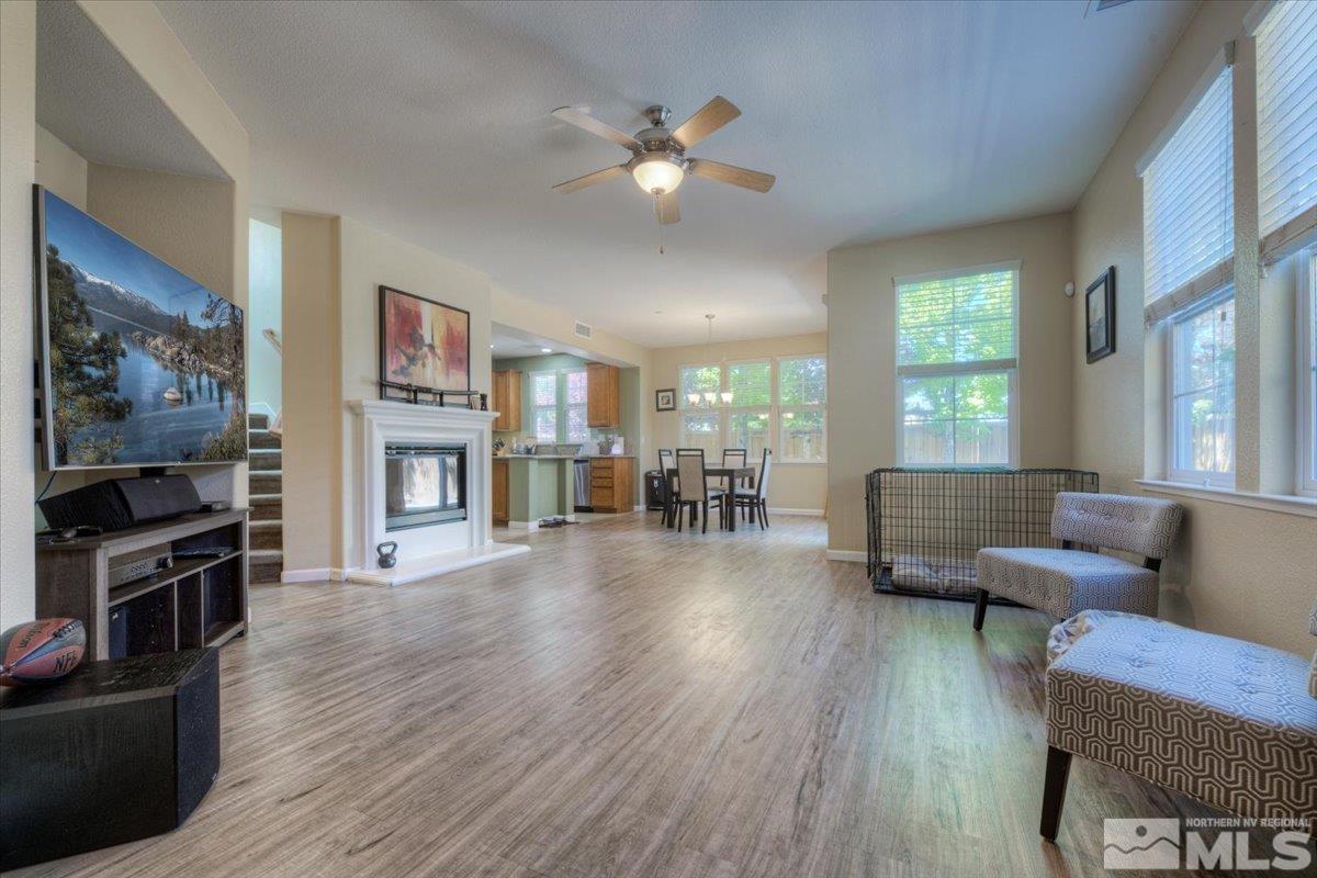 6923 Sacred Circle Sparks, NV 89436 - Photo 8 of 27 a living room with furniture and a flat screen tv