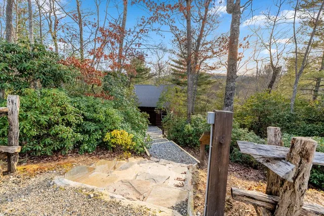 a front view of a house with basket ball court and garage