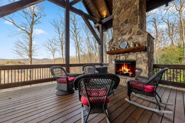 a view of a chairs and a fire pit in the balcony