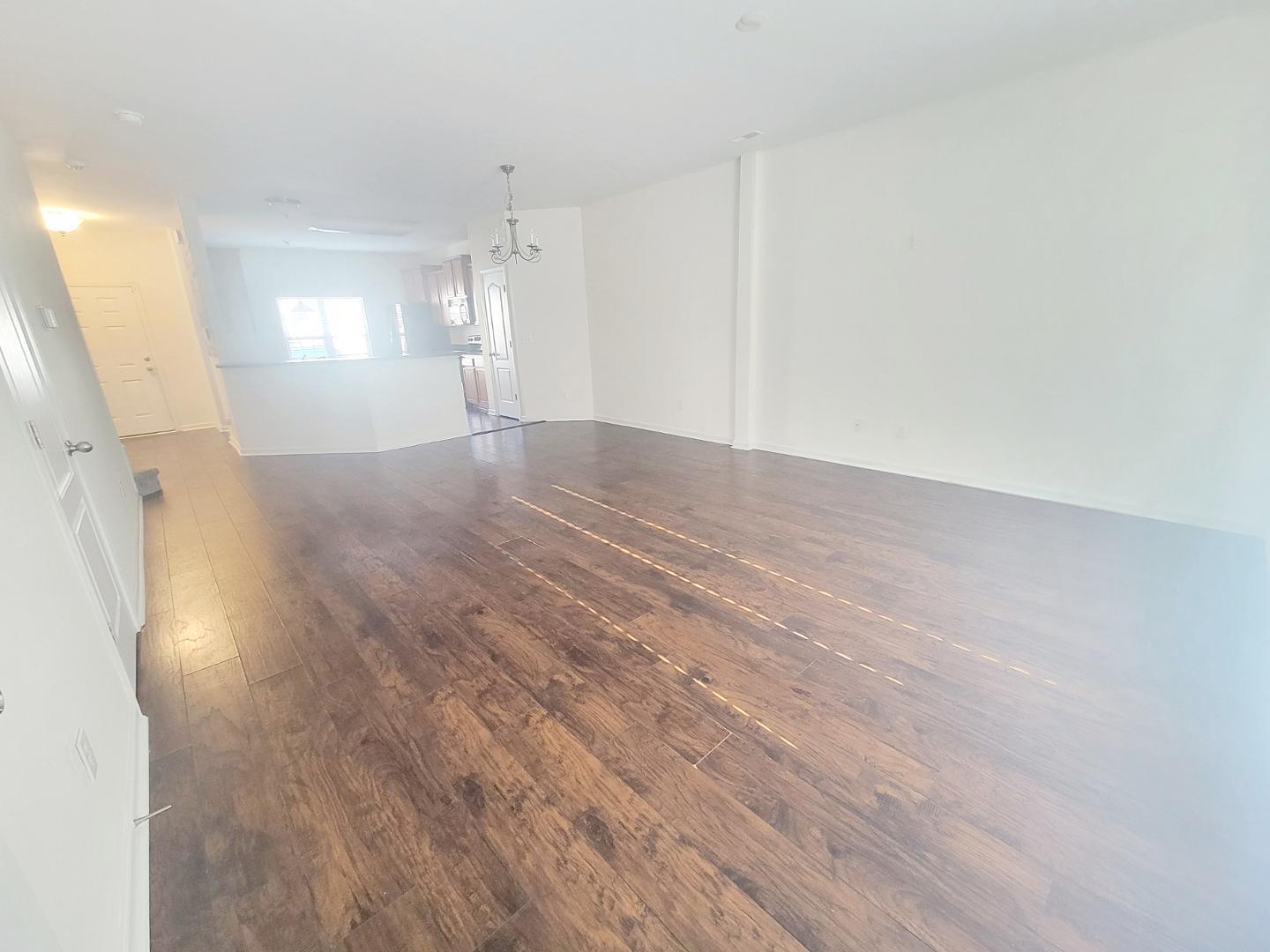 5423 Big Bass Drive Raleigh, NC 27610 - Photo 13 of 42 a view of empty room with wooden floor and window