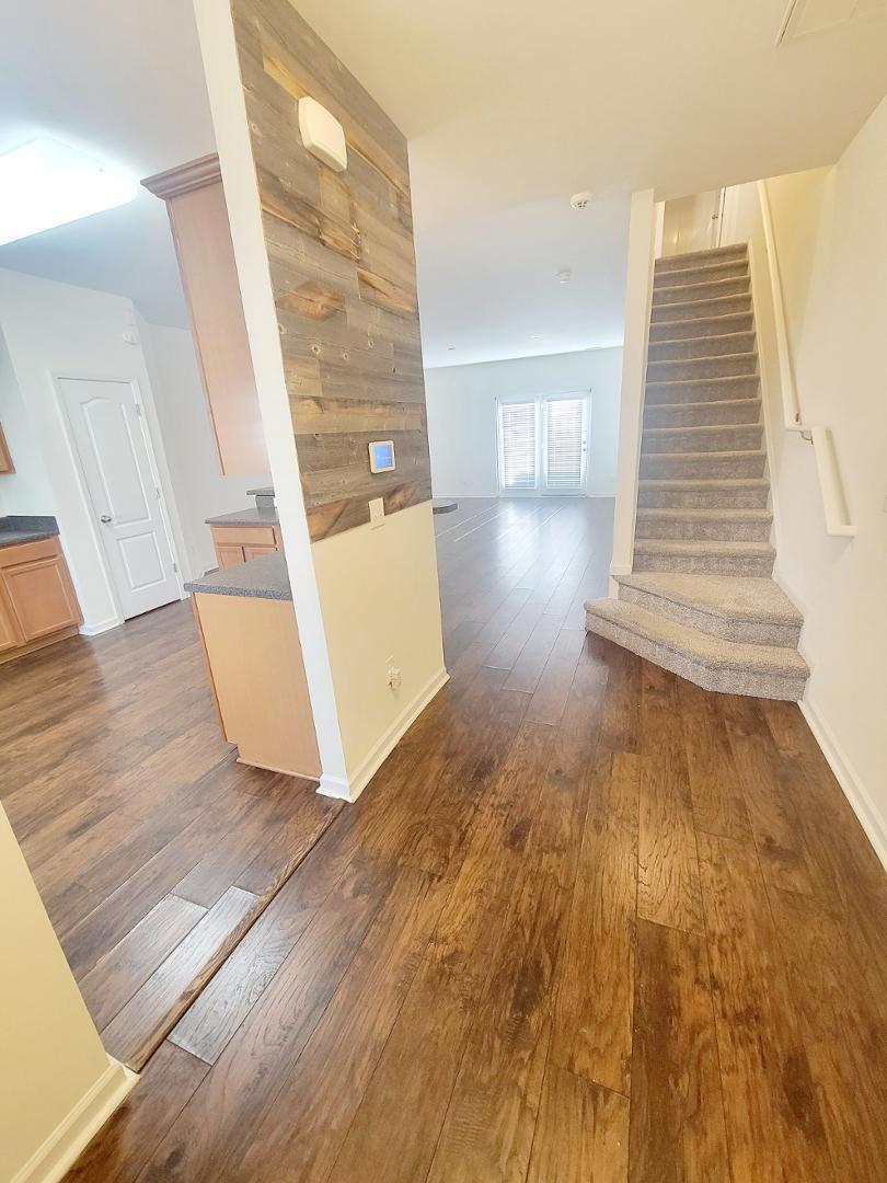 5423 Big Bass Drive Raleigh, NC 27610 - Photo 2 of 42 a view of a living room with wooden floor