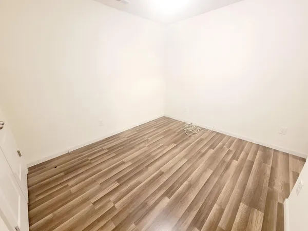a view of wooden floor and a sink