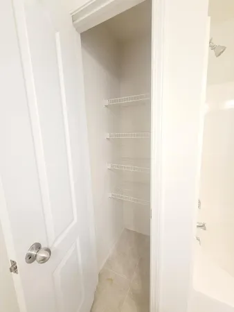 a bathroom with a glass shower door