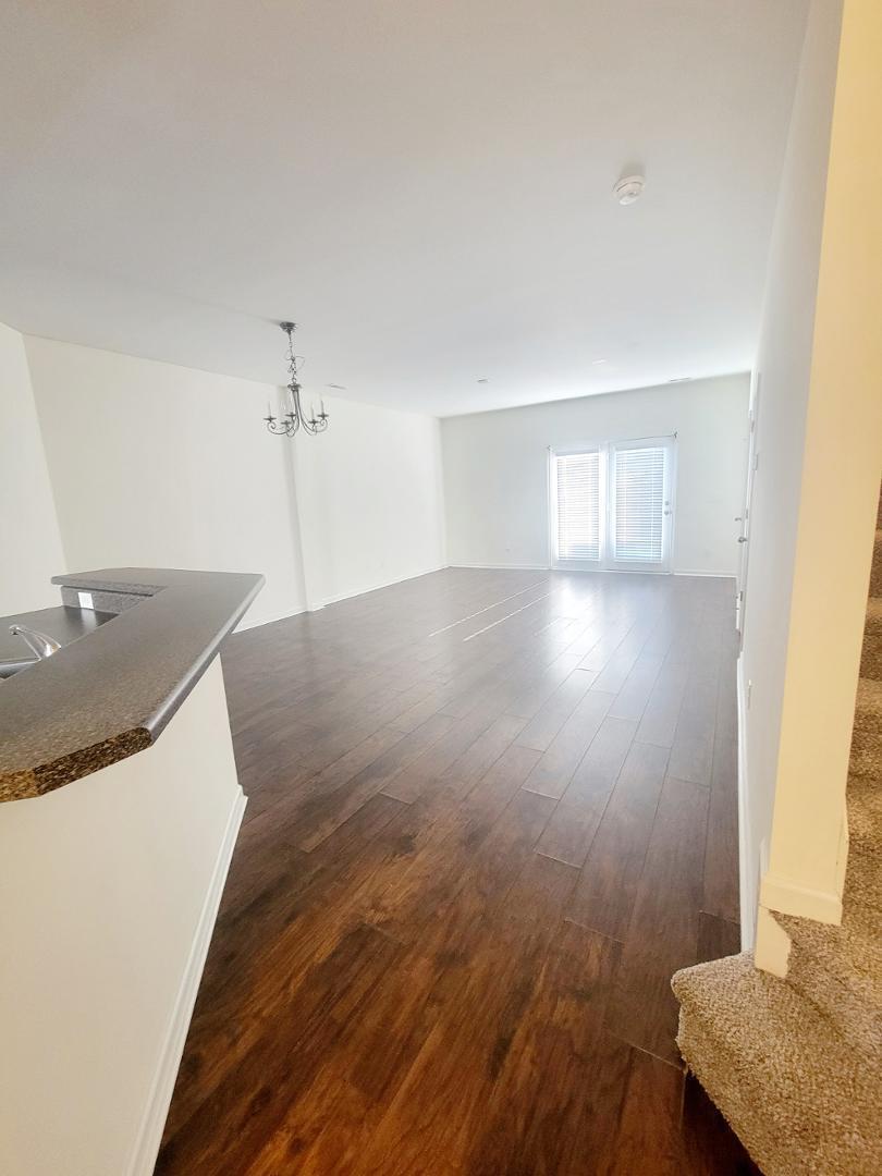 5423 Big Bass Drive Raleigh, NC 27610 - Photo 9 of 42 a view of a kitchen with sink and wooden floor