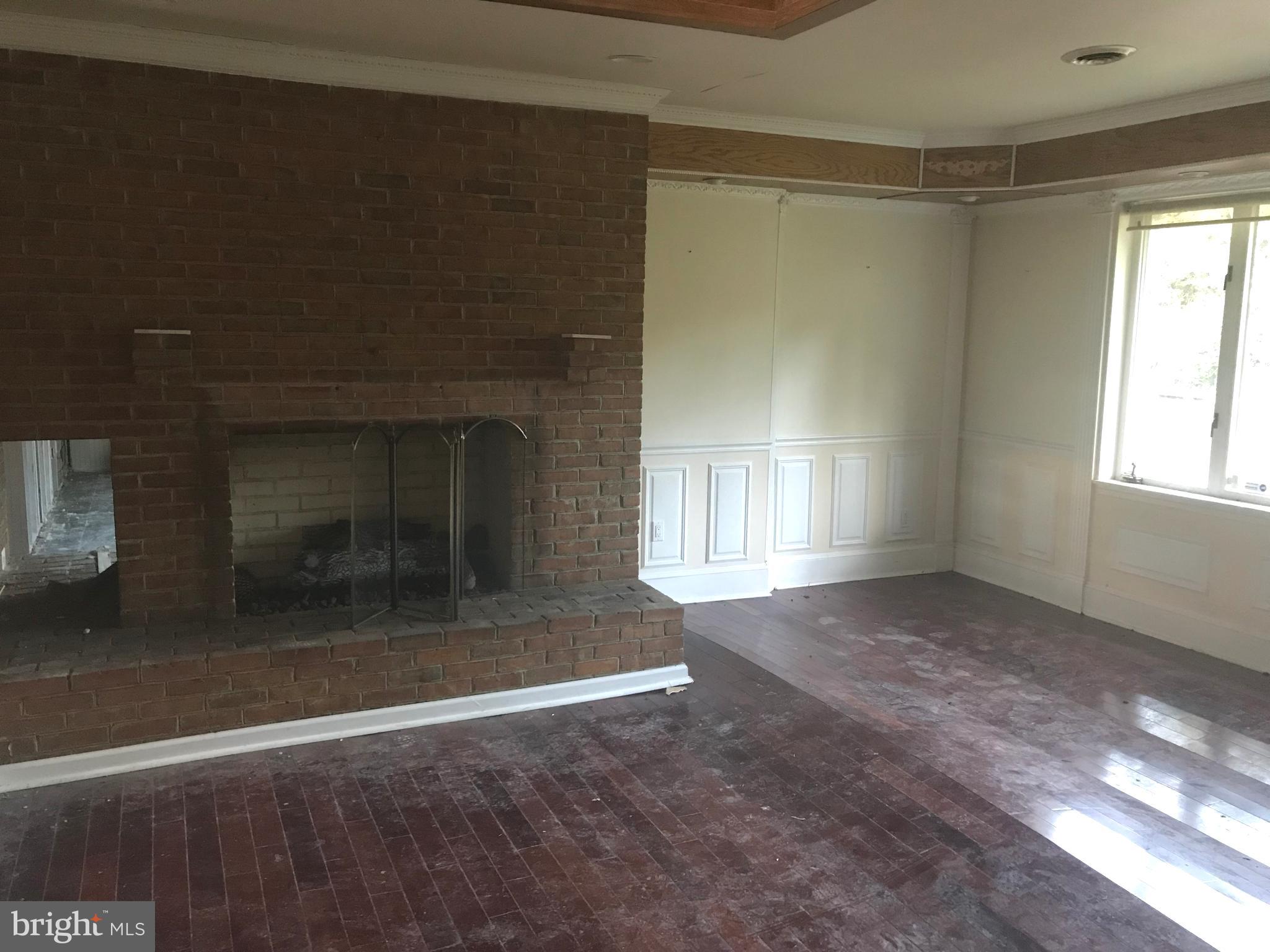 3351 Horn Road Huntingtown, MD 20639 - Photo 5 of 20 Living room with brick fireplace