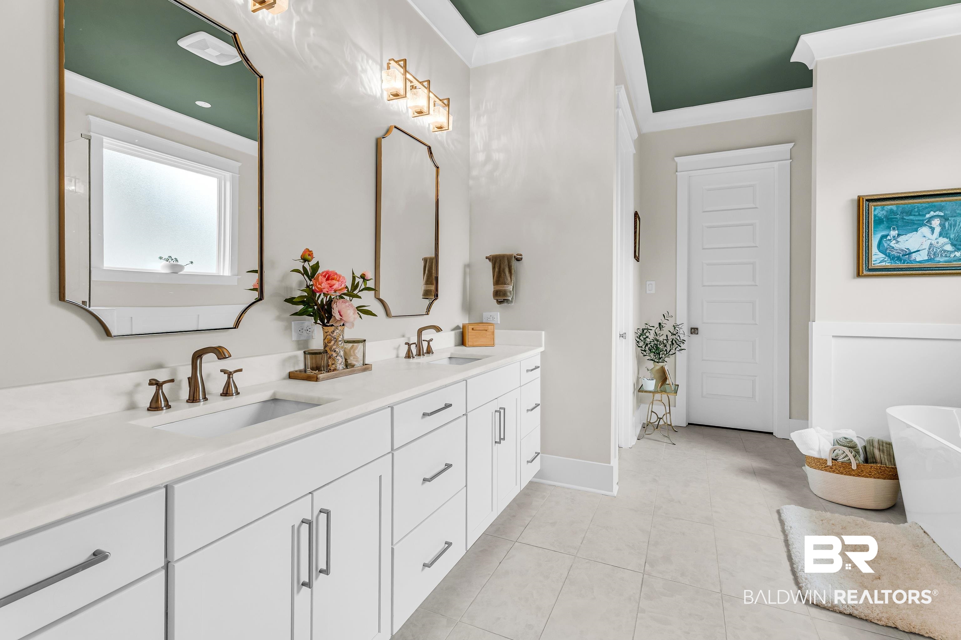 17541 Polo Ridge Boulevard Fairhope, AL 36532 - Photo 8 of 19 Spacious bathroom featuring a double vanity with white cabinetry, light-toned countertops, and dual rectangular mirrors