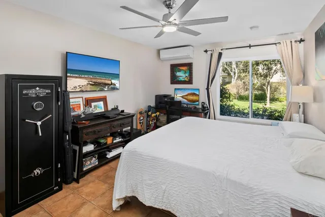 a bed room with a bed and a tv