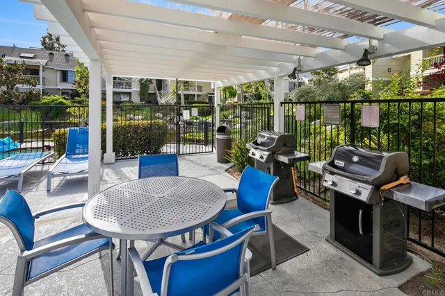 a view of a patio with swimming pool