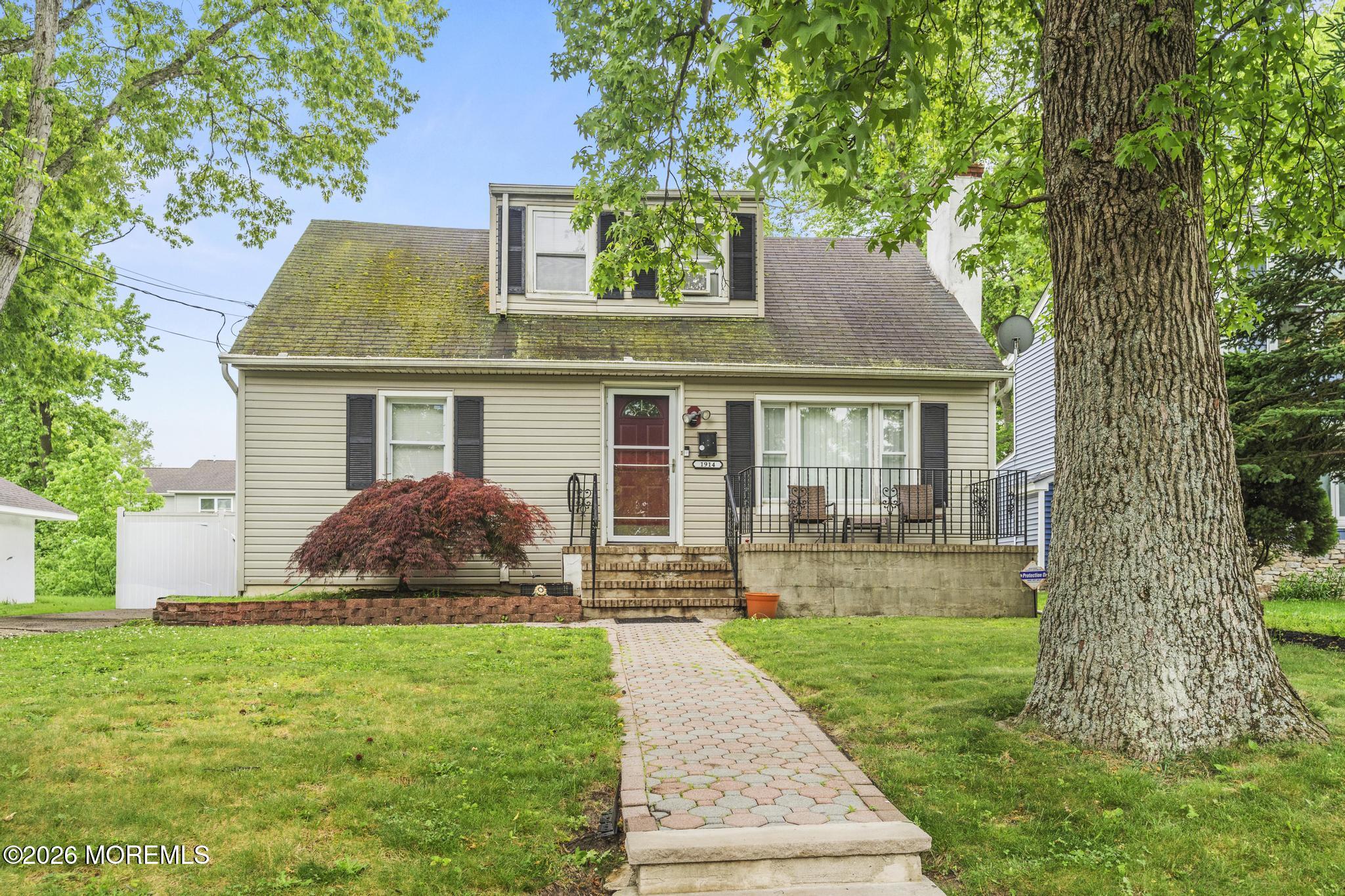 1914 Rutherford Avenue Neptune Township, NJ 07753 - Photo 2 of 25 front view of a house with a yard
