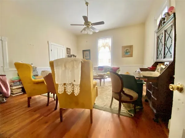 a view of a livingroom with furniture and a window