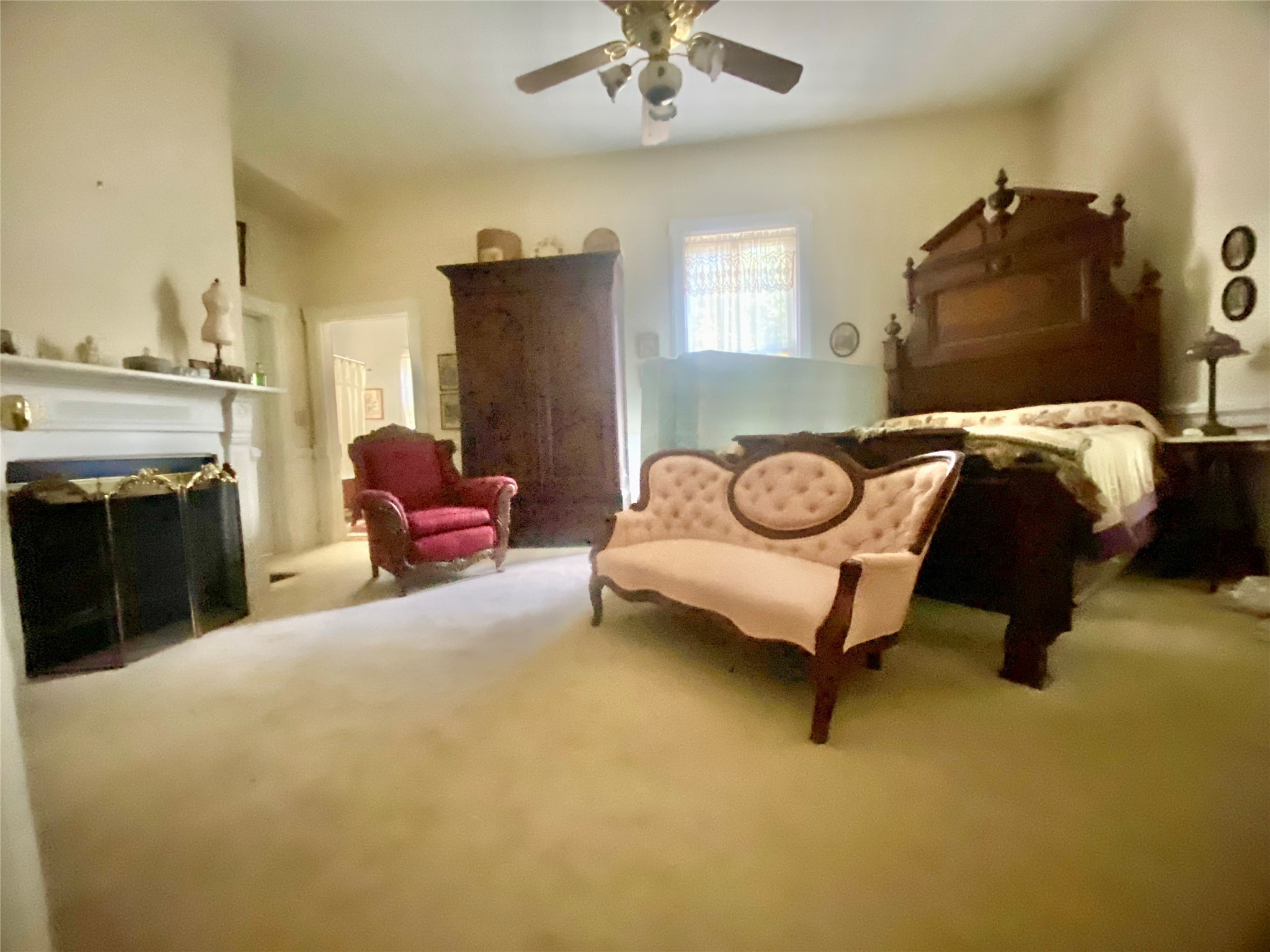 2221 Sandtown Road Washington, GA 30673 - Photo 18 of 50 a bedroom with a bed and a fireplace