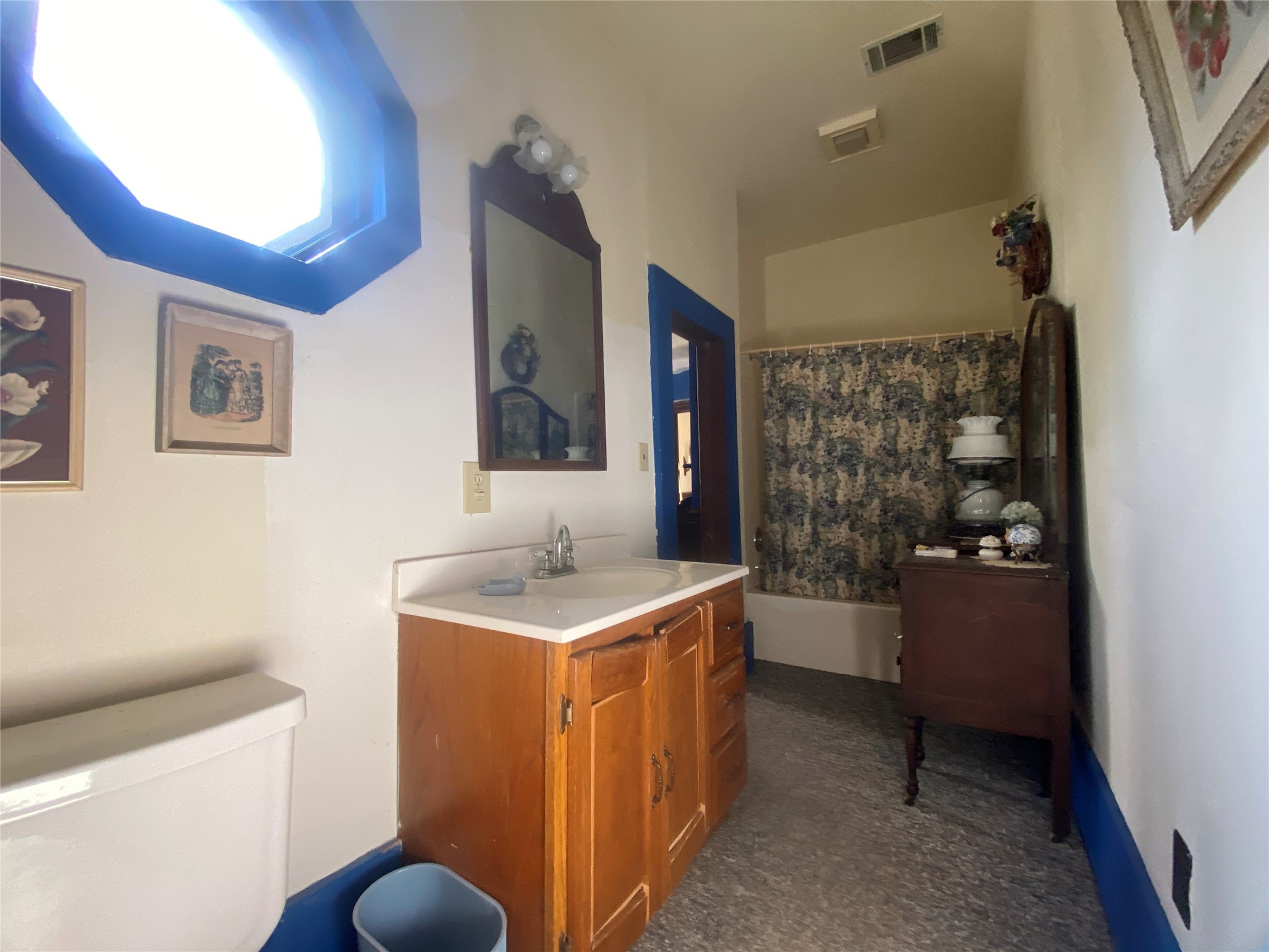 2221 Sandtown Road Washington, GA 30673 - Photo 27 of 50 a bathroom with a sink a toilet and shower