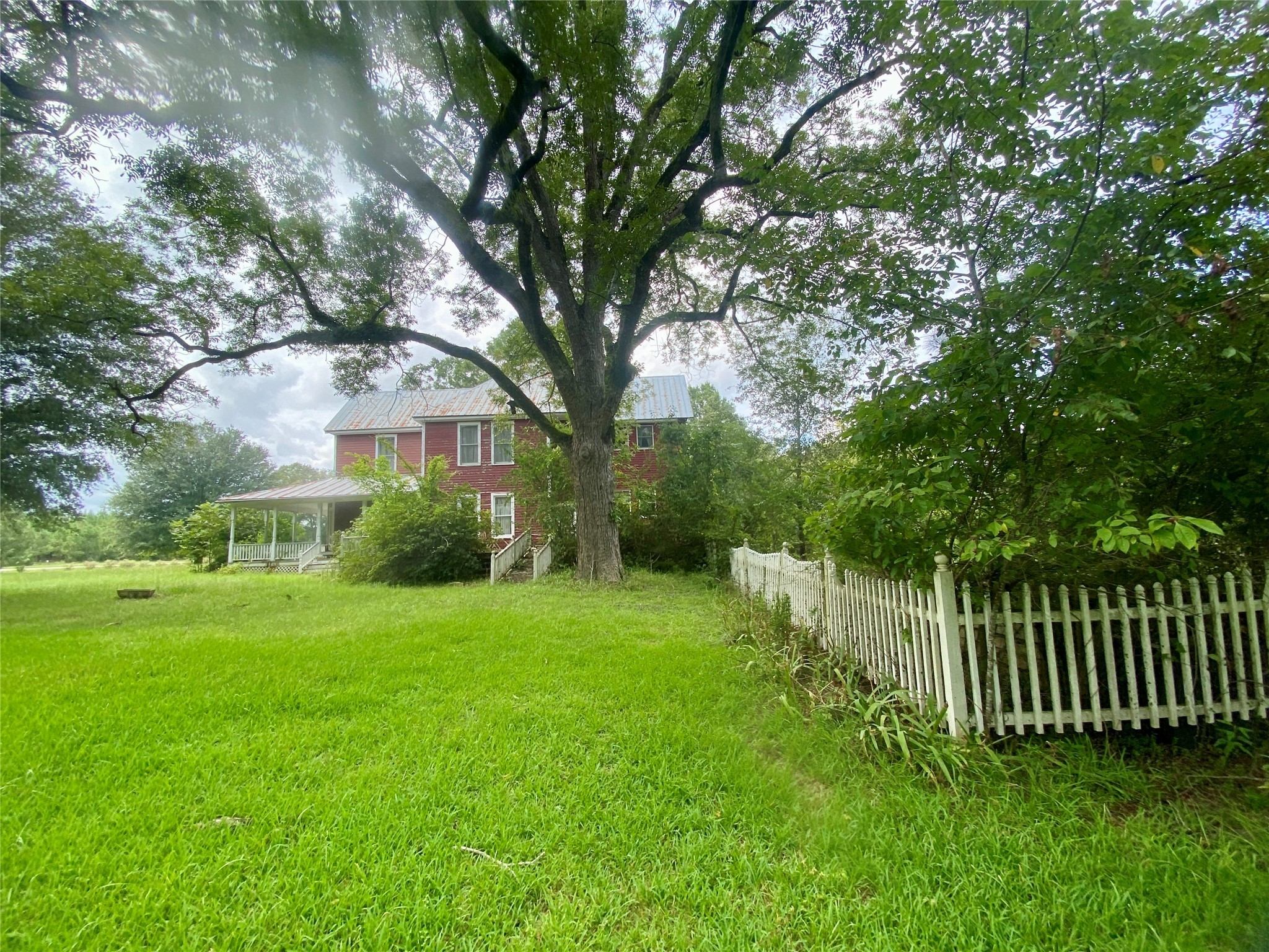 2221 Sandtown Road Washington, GA 30673 - Photo 33 of 50 a view of a house with a yard